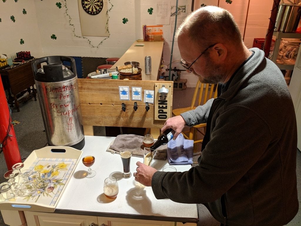 The brewmaster pours the samples