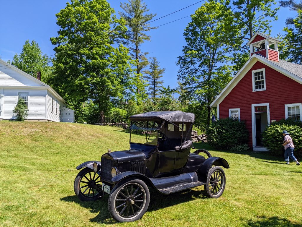 Antique car and schoolhouse